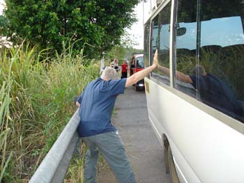 Tom holding up the bus